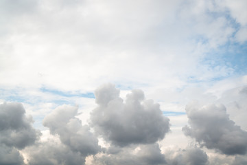Bunchy and layered clouds at the top of the photo. Cumulus clouds at the bottom of the photo.