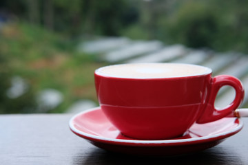 cup of coffee on wooden table