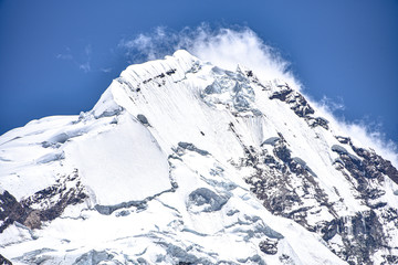 Obraz premium The snow capped peak of Mt Ausungate, standing at 6,384m (20,945ft) above sea level. Cordillera Vilcanota, Cusco, Peru