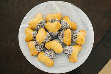 plate of sweet salted cookies on wooden floor.