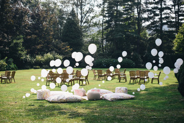 white and pink balloons installed in the garden birth for a children's party