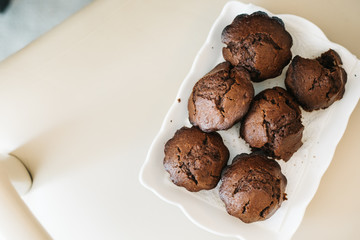 Chocolate homemade cupcakes muffins. in white plate