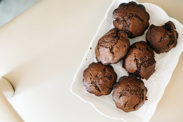 Chocolate homemade cupcakes muffins. in white plate