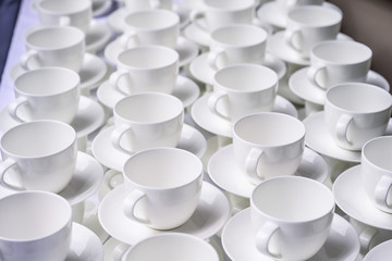 Abstract blurred many stacked rows of coffee tea cups