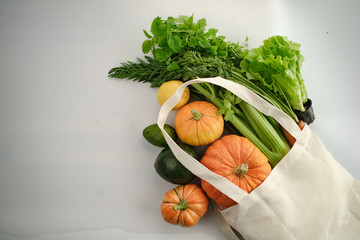 zero waste food shopping. eco natural bags with fruits and vegetables in tote, eco friendly, flat...