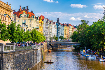 Scenic embankment in Prague city; Historical center of Prague, buildings and landmarks of old town,...