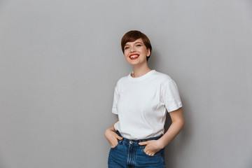 Image of adorable brunette woman wearing casual t-shirt smiling at camera