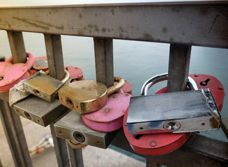 Lock for couple make a promise to love forever, master keys hanging on the rails of bridge, the...