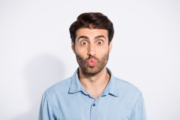 Obraz premium Photo of amazing arabian macho guy looking with big opened eyes sending air kiss to pretty girlfriend wear casual denim shirt isolated white color background