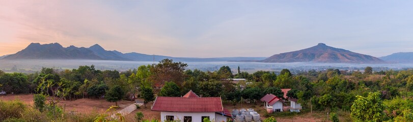 Fototapeta premium panoramic view of sunrise with clear sky on Mountain,Phu Luang District, Thailand
