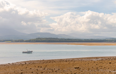 Boats and misty hills.