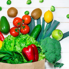 An eco-friendly paper bag with fresh food for a healthy diet.