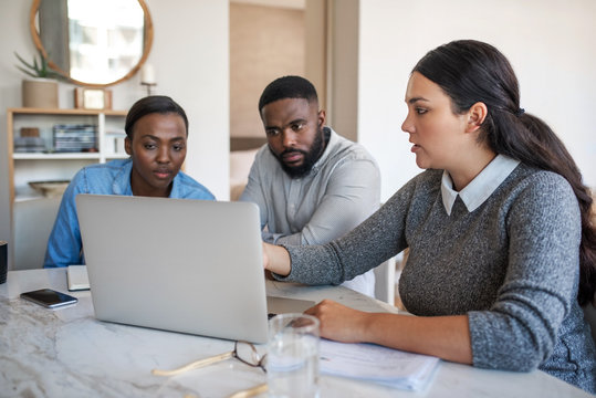 Financial Planner Talking With An African American Couple At Home