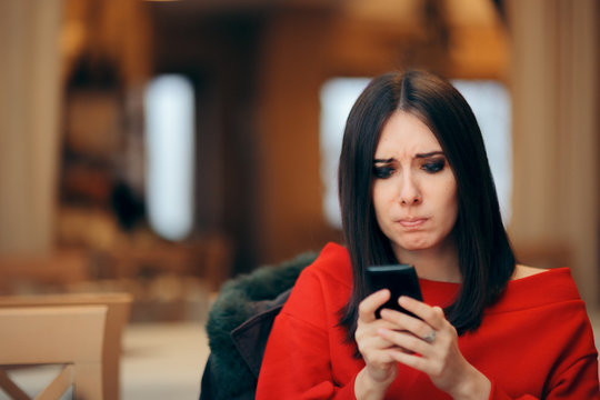 Stressed Woman Reading Text Message on Smartphone