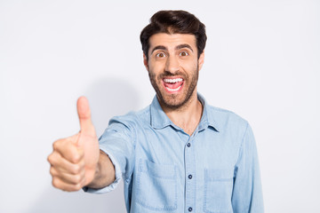 Close up photo of amazing mixed race multiethnic macho guy raising thumb up express positive attitude wear casual denim shirt isolated white color background