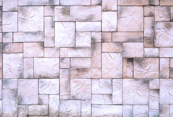 The decorative stone wall is beautifully lined with rectangles of different sizes