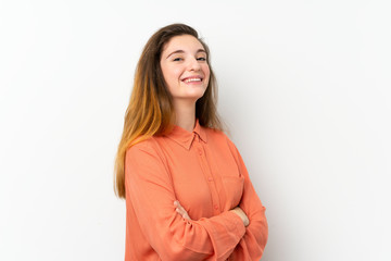 Obraz premium Young brunette girl over isolated white background with arms crossed and looking forward