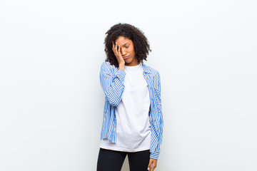 young cool african american woman feeling bored, frustrated and sleepy after a tiresome, dull and...