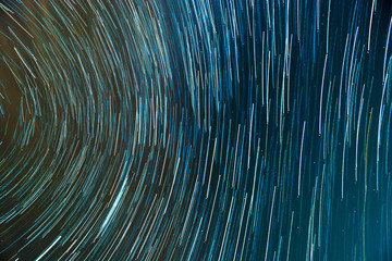 Lines of moving stars on dark background