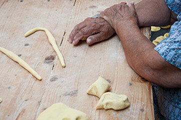 Rest during work. Working hands. Hands of an old woman. Italian small business owners. Ancient tradition of the homemade fresh pasta from Bari, region Puglia, Italy.