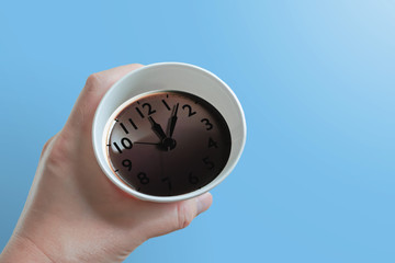 coffee time. Coffee and clock reflected on the surface. ...