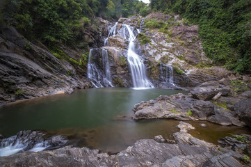 Krung Ching waterfall in the deep forest on mountain of Khao Luang National Park, Nakhon Si Thammarat province, Thailand..