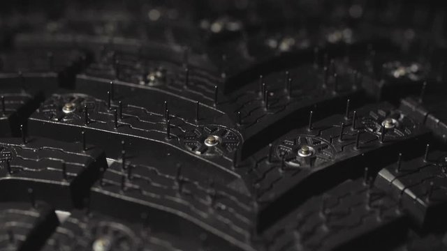 Car Winter Tire with Studded Close-Up