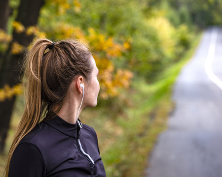 The silhouette of the young girl, who is trying hto reach the best results in medimarathon distance by autumn. The picture 5:7