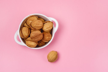 White Bowl of Tasty Homemade Nuts Cookies on Pink Background Holiday Tasty Homemade Dessert Copy Space