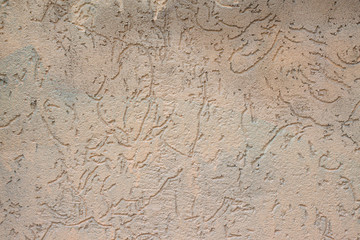 Texture of grey brown wall with curvy pattern