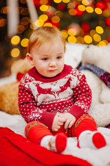 Happy fun child paying at home on Christmas time. Xmas holiday concept