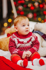 Happy fun child paying at home on Christmas time. Xmas holiday concept