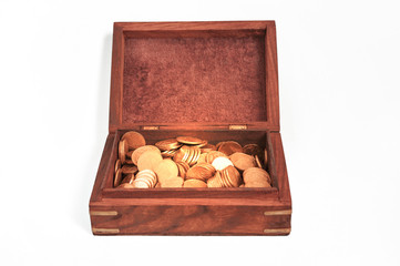 Old wooden chest with golden coins isolated on the white background