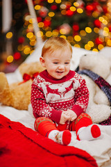 Happy fun child paying at home on Christmas time. Xmas holiday concept