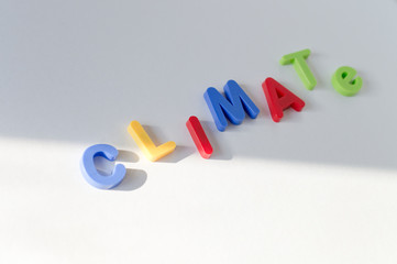 Climate change concept flat lay with colorful letters on white background