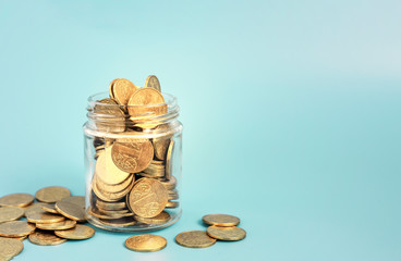 Glass jar for tips with money isolated