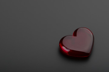 red heart on black background