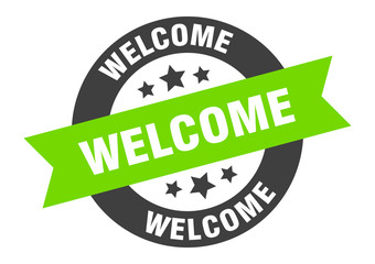 welcome sign. welcome black-green round ribbon sticker