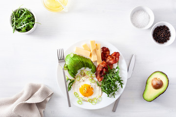 healthy keto breakfast: egg, avocado, cheese, bacon
