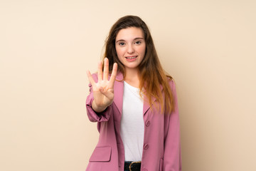 Young brunette girl with blazer over isolated background happy and counting four with fingers