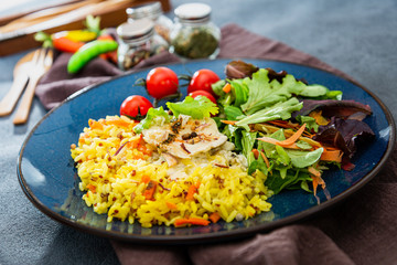 Andalusian fish, saffron rice with vegetables