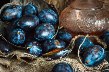 Plum. Fresh plum. Harvest. fresh blue plums on a dark table. Autumn harvest of plums. healthy eating concept. Food Photo