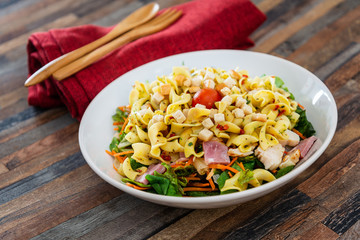 tasty pasta with roast ham on the table
