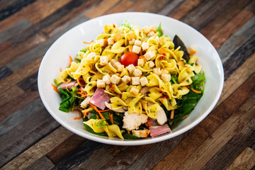 tasty pasta with roast ham on the table