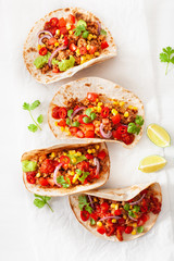 mexican beef and pork tacos with salsa, guacamole and vegetables