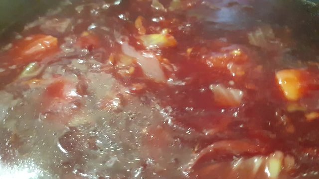 Borsch is cooked in a pan. Cooking fresh borsch.