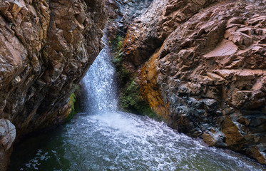 Panoramic view of a picturesque Millomeris waterfall and stream in the forest at Troodos mountains Cyprus, amazing natural landmark.