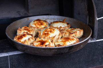 Cooking delicious pies in a Russian oven