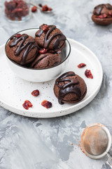 Chocolate chip cookies with chocolate smudges with cranberry jam