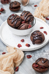 Chocolate chip cookies with chocolate smudges with cranberry jam